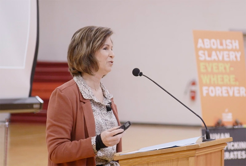 Woman talking into microphone