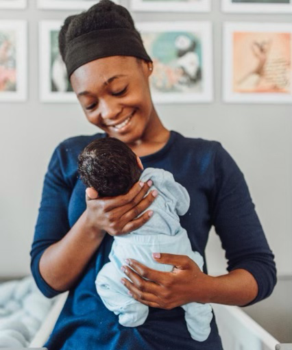 Woman holding orphan baby